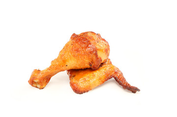 Heap of roasted chicken leg and wing isolated on white background with clipping path..