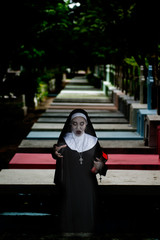Rendering of a ghost nun or demon in the dark mysterious at the Churchyard.