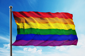 LGBT flag waving against blue background. 3D illustration