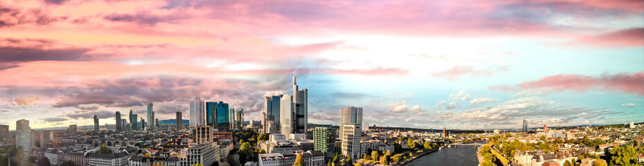 Obraz premium Frankfurt/Main Skyline Panoramic Aerial Drone Shot along the river at dusk