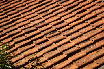 Orange tiles on the roof of the house. Close-up. Background picture