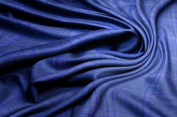 Naklejka na ściany i meble Texture, background, pattern. Blue-lilac checkered cashmere fabric with for sewing clothes.
