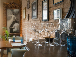 Interior with empty glasses on the bar.
