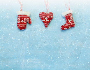Christmas decorations hanging on a blue background. - 290691670