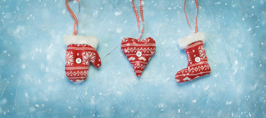 Christmas decorations hanging on a blue background. - 290691675