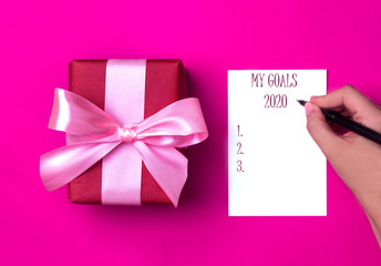 Gift box on a beautiful background with a satin ribbon. Holiday concept