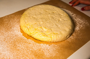 Yeast dough on the table. Baking concept. Cooking ideas. Homemade food. Knead flour and water.