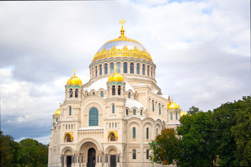 Nicholas the wonderworker's church on Anchor square in kronstadt town Saint Petersburg. Naval christian cathedral church in russia with golden dome, unesco architecture at sunny day cloudy
