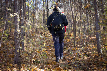 Fototapeta premium young man carries a log