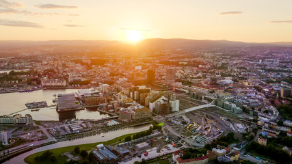 Oslo, Norway. City view during sunset. Back light. The central part of the city, From Drone - obrazy, fototapety, plakaty