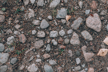 Land with stones top view. Texture with stones. Photo background concept with copy space on the theme of stones and nature.