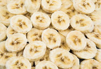 Fototapeta na wymiar Sliced bananas as texture to background