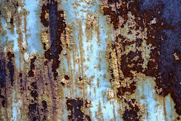   Rusty metal texture, blue paint residue on the surface    