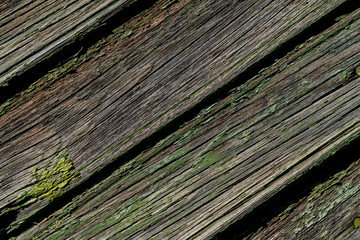 Gray boards with peeling green paint texture. Diagonal boards with different lines, scuffs. Cracks...