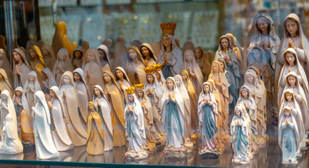 statues or figurines in a shop, the commercial side of Lourdes.