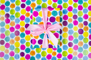 Colorful gift on colorful background