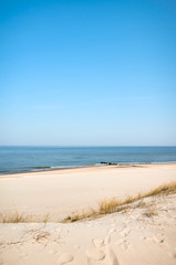 Fototapeta na wymiar Photo of a sea coast sand dune on a sunny day