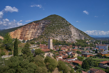 Obraz premium Air view of a marble quarry. Panoramic view of the extraction of marble in the quarry. Technique in the marble quarry of Brescia, Italy. Open pit mine.