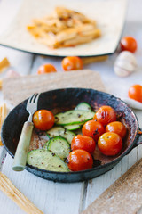 Fresh and juicy roasted tomatoes and cucumbers.