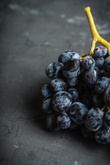 Ripe grape on the rustic background. Selective focus. Shallow depth of field.