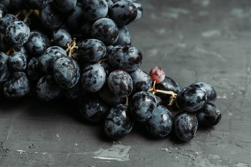 Ripe grape on the rustic background. Selective focus. Shallow depth of field.
