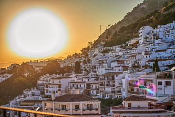 Views of the town of Mijas at sunset, when the sun is setting.