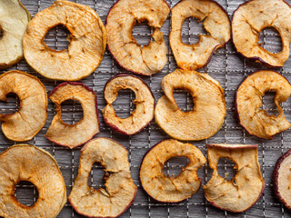 dehydrated apple fruit in metal tray, close up
