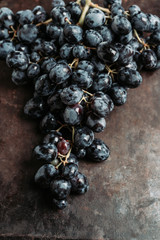 Ripe grape on the rustic background. Selective focus. Shallow depth of field.