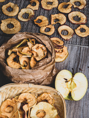 Tasty apple chips on wooden table, healthy vegan vegetarian fruit snack or ingredient for cooking