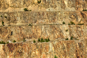 abandoned huge quartz qarry in mountains - background