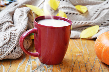 Fototapeta na wymiar Pumpkin Spice Latte. Cup of Latte with Seasonal Autumn Spices, Cookies and Fall Decor. Traditional Coffee Drink for Autumn Holidays.