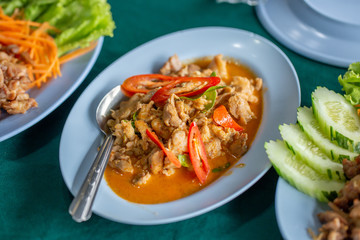 The pork curry on dish with meat and vegetable. 