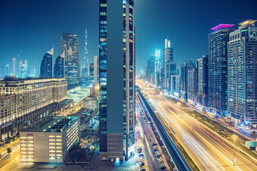 Fototapeta na wymiar Downtown Dubai at night. Elevated view on highways and skyscrapers.