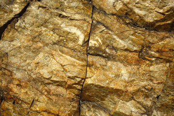 rock background - natural cracked decorative stone texture
