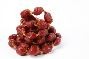Dried meat sausages. Photo on a white background. Copy space. Isolated object.