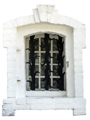 antique white window in a white brick frame and forged lattice, closeup