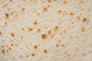 thin wheat cake - pita bread. Food background, close up