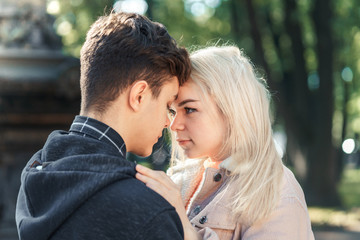 Girlfriend and Boyfriend are looking at each other in the park, concept of love and happiness