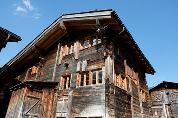 Front of an old wooden house with traditional construction in Obergoms Switzerland