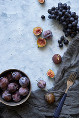 healthy fruits in assortment in plates grapes fig plums