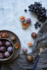 healthy fruits in assortment in plates grapes fig plums