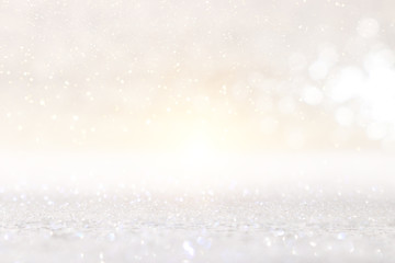 abstract backgrounf of glitter vintage lights . silver and white. de-focused