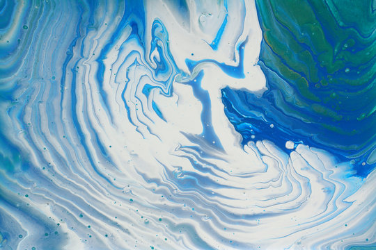 art photography of abstract marbleized effect background. turquoise, emerald green, blue, white and gold creative colors. Beautiful paint.