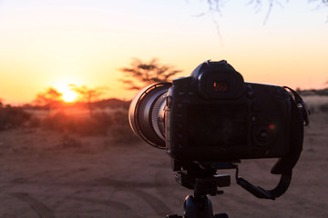 Camera on tripod, sunset light, Namibia