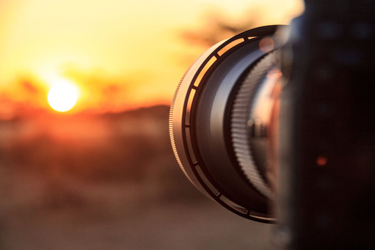 Close up of a camera lens, sunset light, Namibia