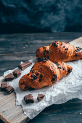 chocolate croissants on wooden table