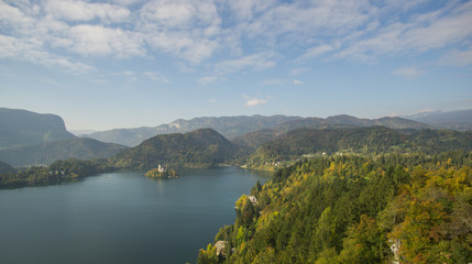 Travailing around  Lake Bled In Slovenia an amazing lake full of impressive nature , crystal blue water with a beautiful island in the middle surrounded by those beautiful mountains and trees. 