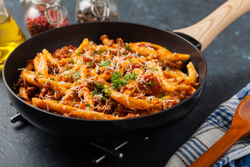 Maccheroni al ferretto with beef in ragu bolognese. Front view.