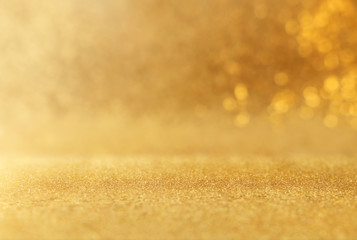 background of gold glitter lights. de focused