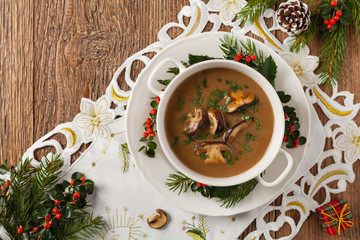 Traditional mushroom soup, made from porcini mushrooms. Christmas decoration.